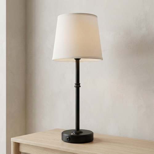 Black table lamp from a side angle in matching setting